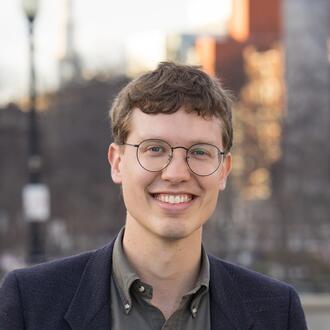 Headshot of MIT Sloan Associate Professor Nathan Wilmers